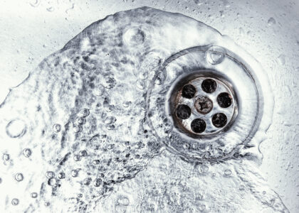 un clogged shower drain