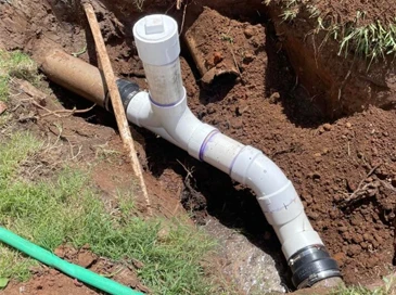 Image of plumber performing a Sewer line repair